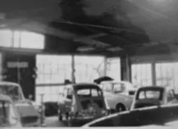 Archieffoto van de werkplaats van Autobedrijf Dalhoeven in 1963